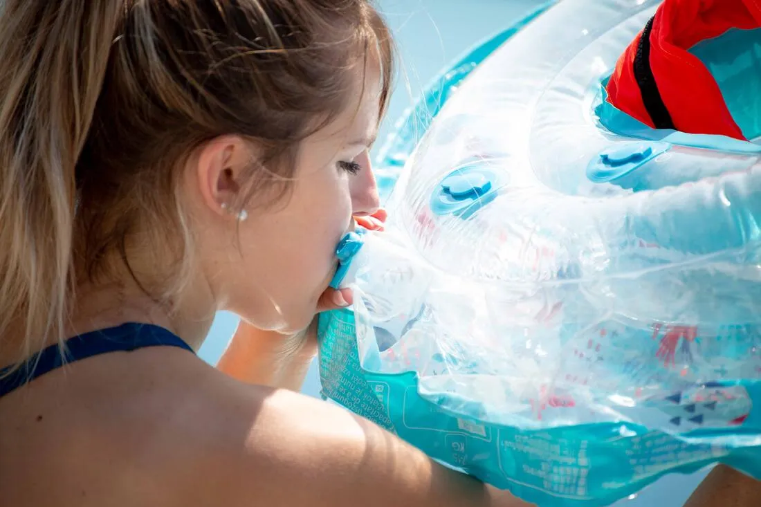 Baby's inflatable pool ring, seat and handles for infants 7- 15 kg transparent