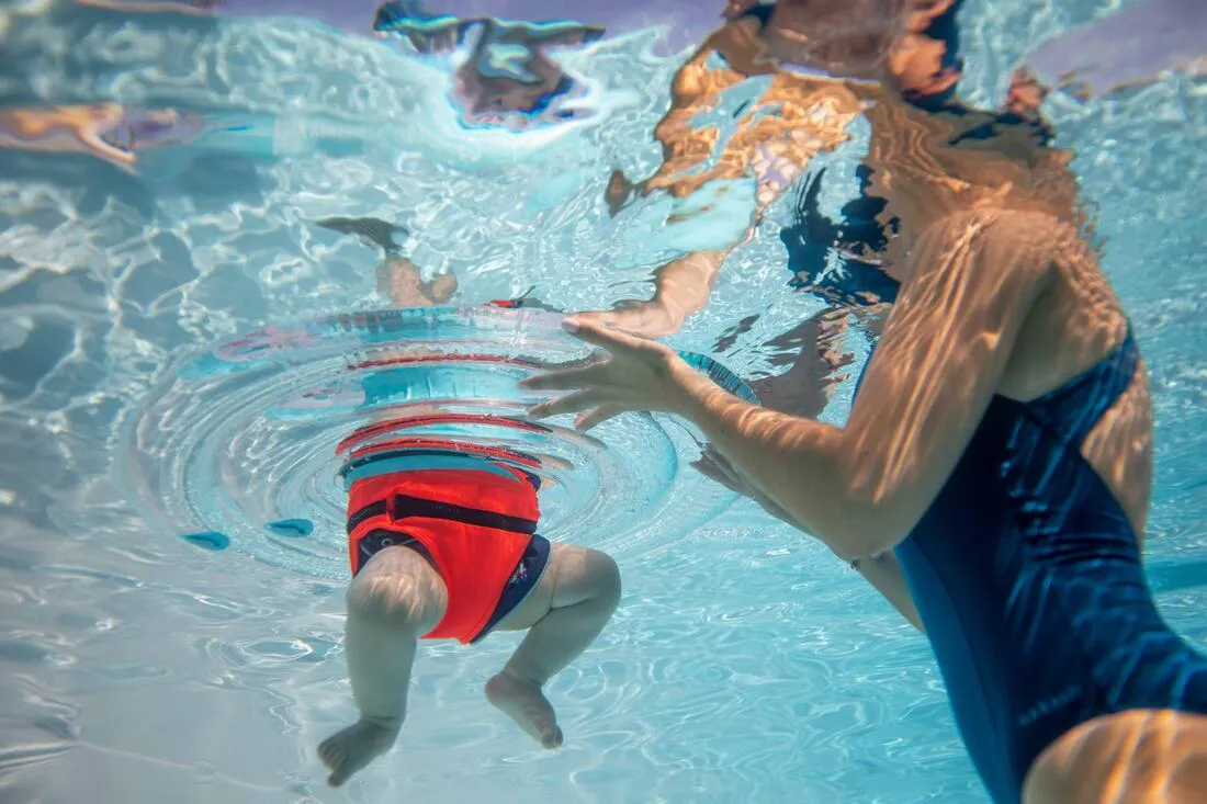 Baby's inflatable pool ring, seat and handles for infants 7- 15 kg transparent