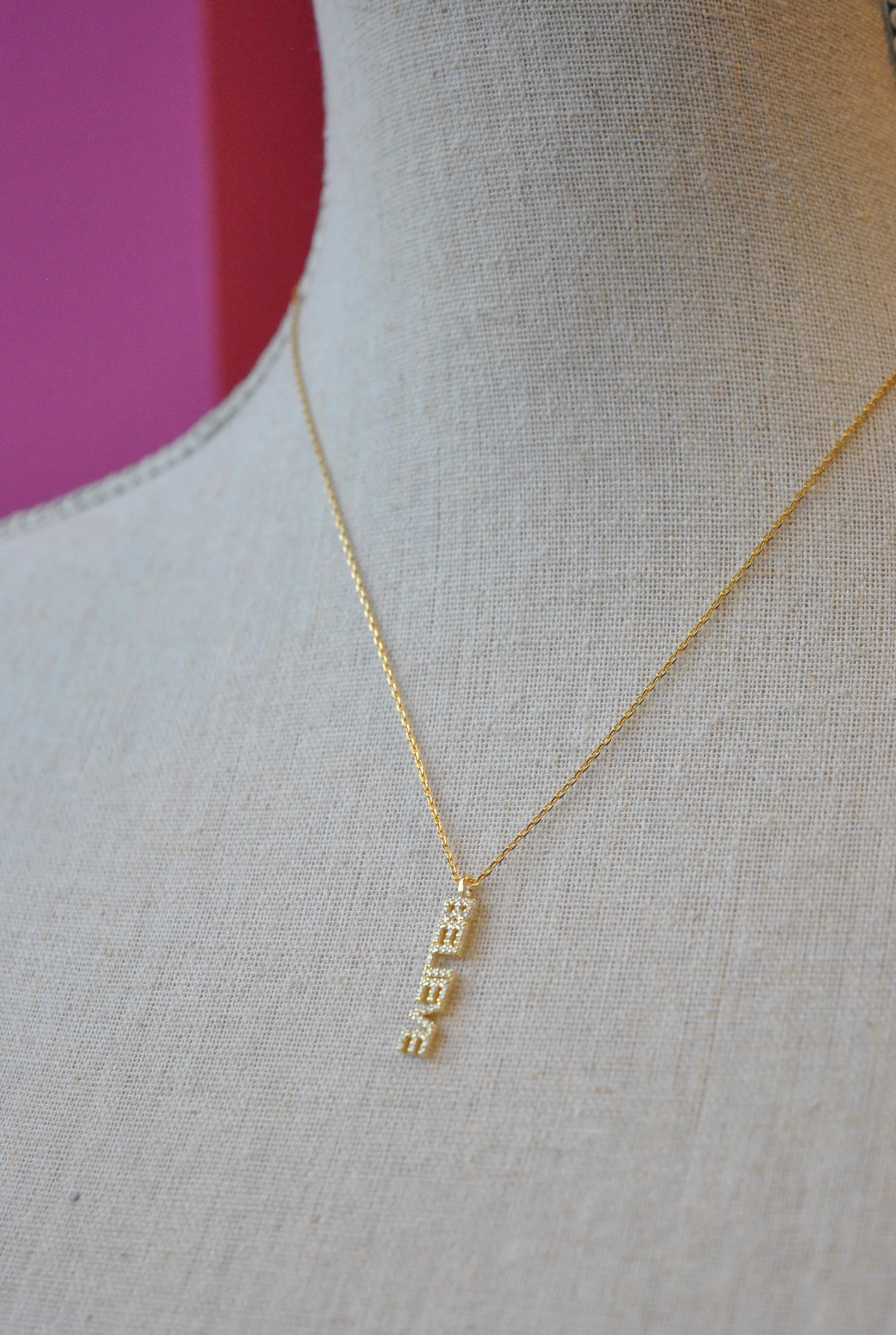 GOLD DELICATE NECKLACE WITH "BELIEVE' CHARM