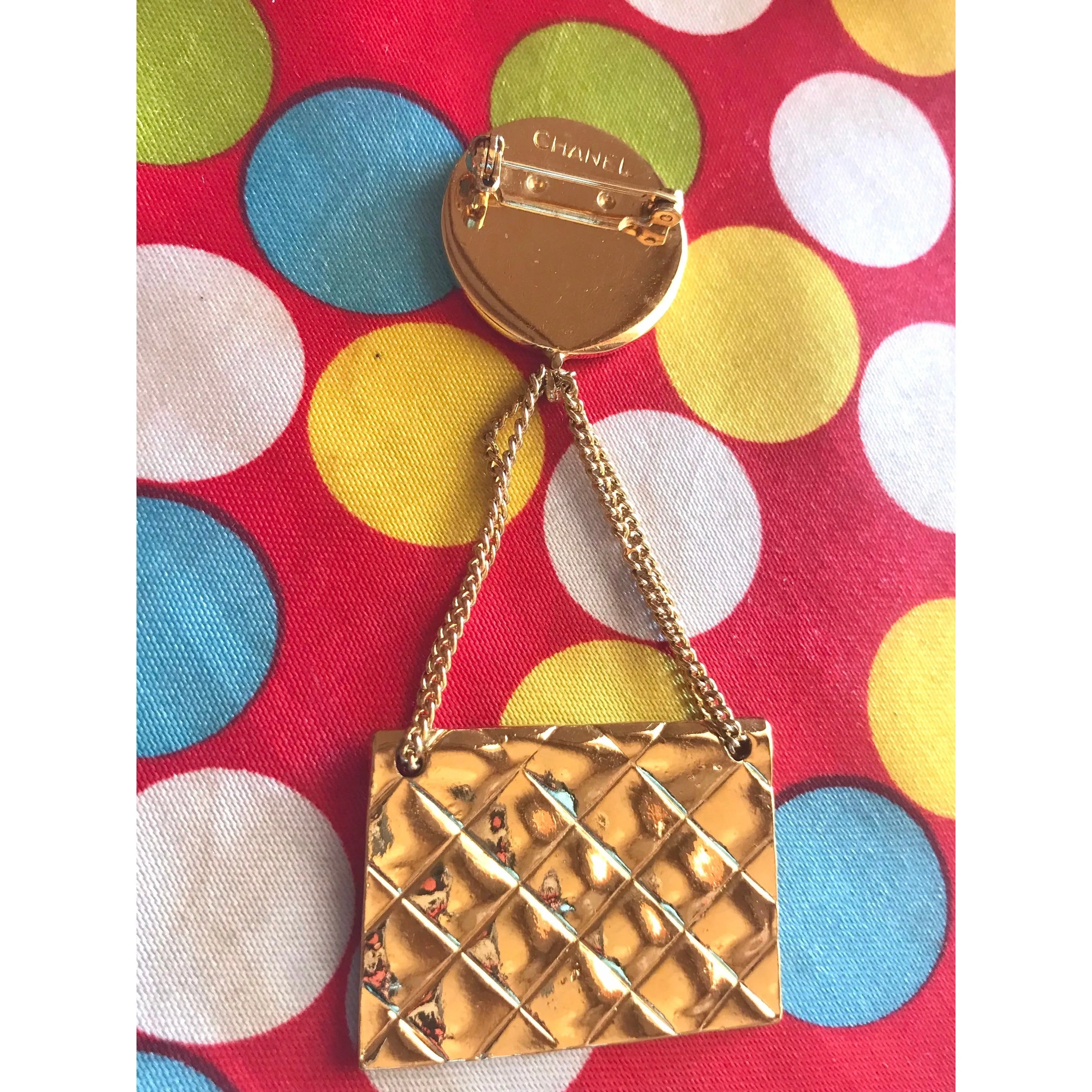 MINT. Vintage CHANEL Gold tone brooch with 2.55 classic purse and CC charms. Chic dangling brooch. Gorgeous masterpiece jewelry. 050406r4