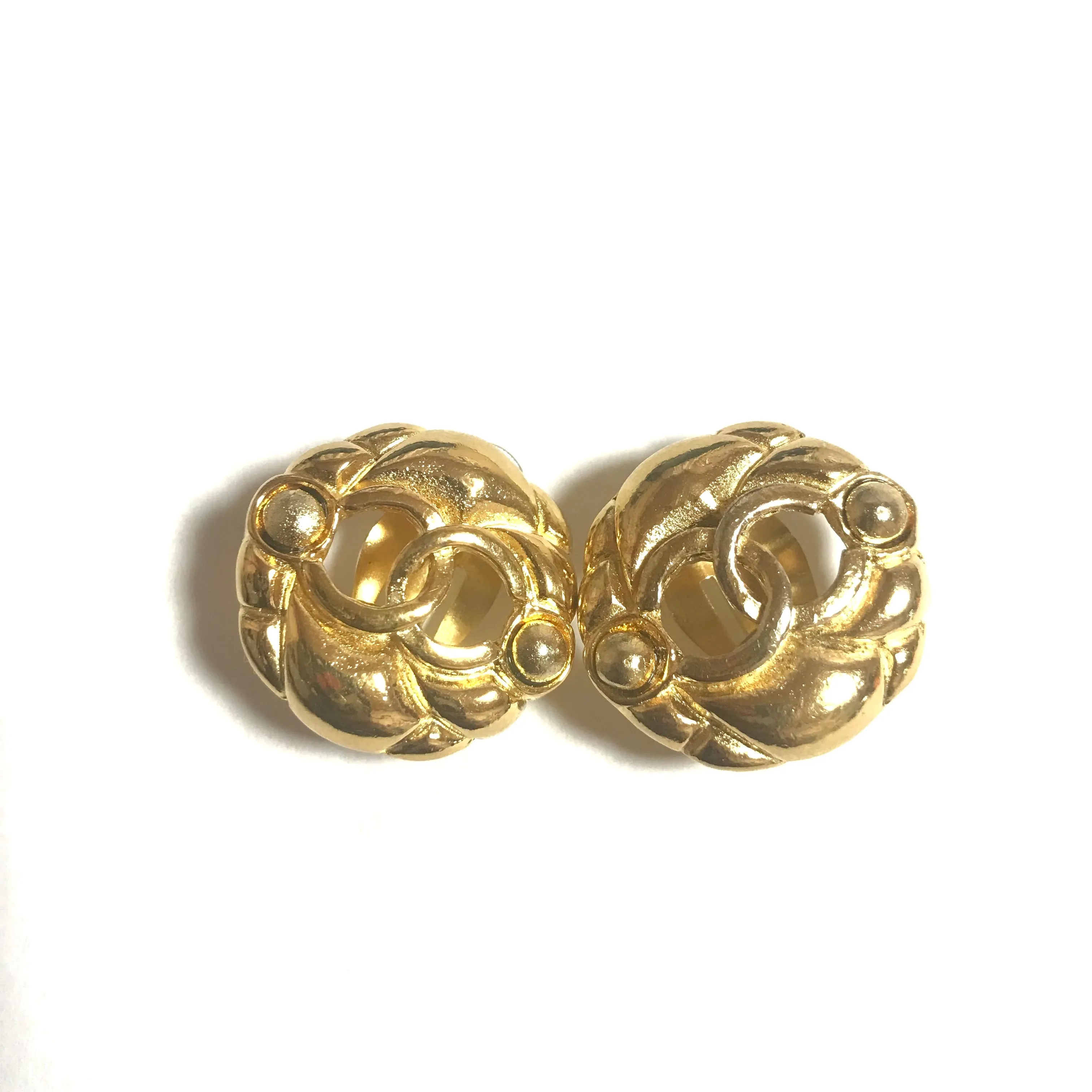 Vintage CHANEL gold tone round earrings with CC mark. Classic vintage Chanel jewelry.