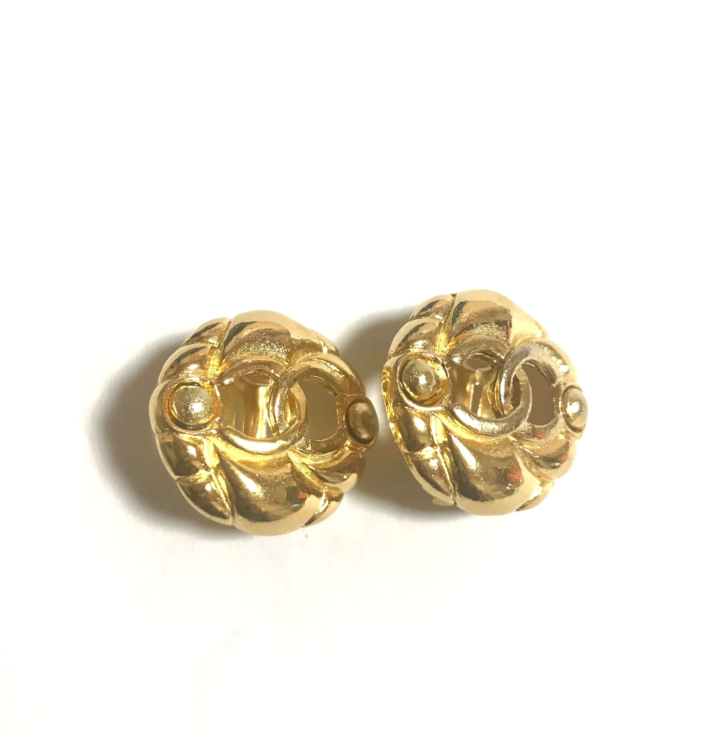 Vintage CHANEL gold tone round earrings with CC mark. Classic vintage Chanel jewelry.