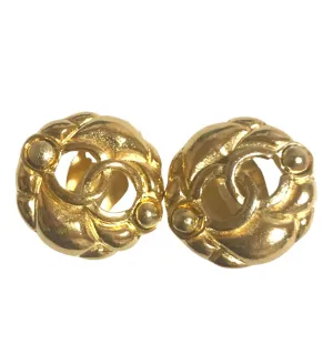 Vintage CHANEL gold tone round earrings with CC mark. Classic vintage Chanel jewelry.