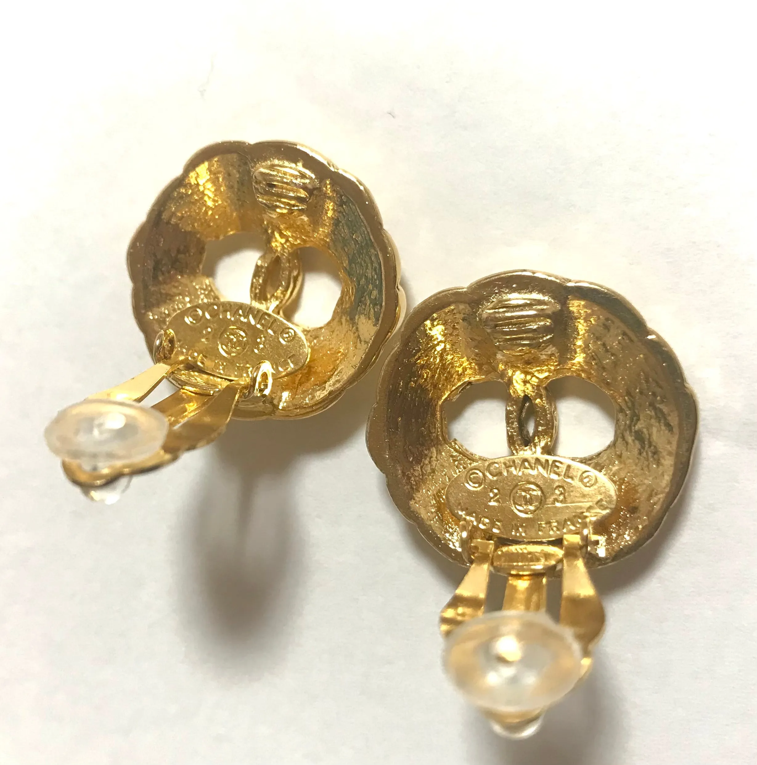 Vintage CHANEL gold tone round earrings with CC mark. Classic vintage Chanel jewelry.