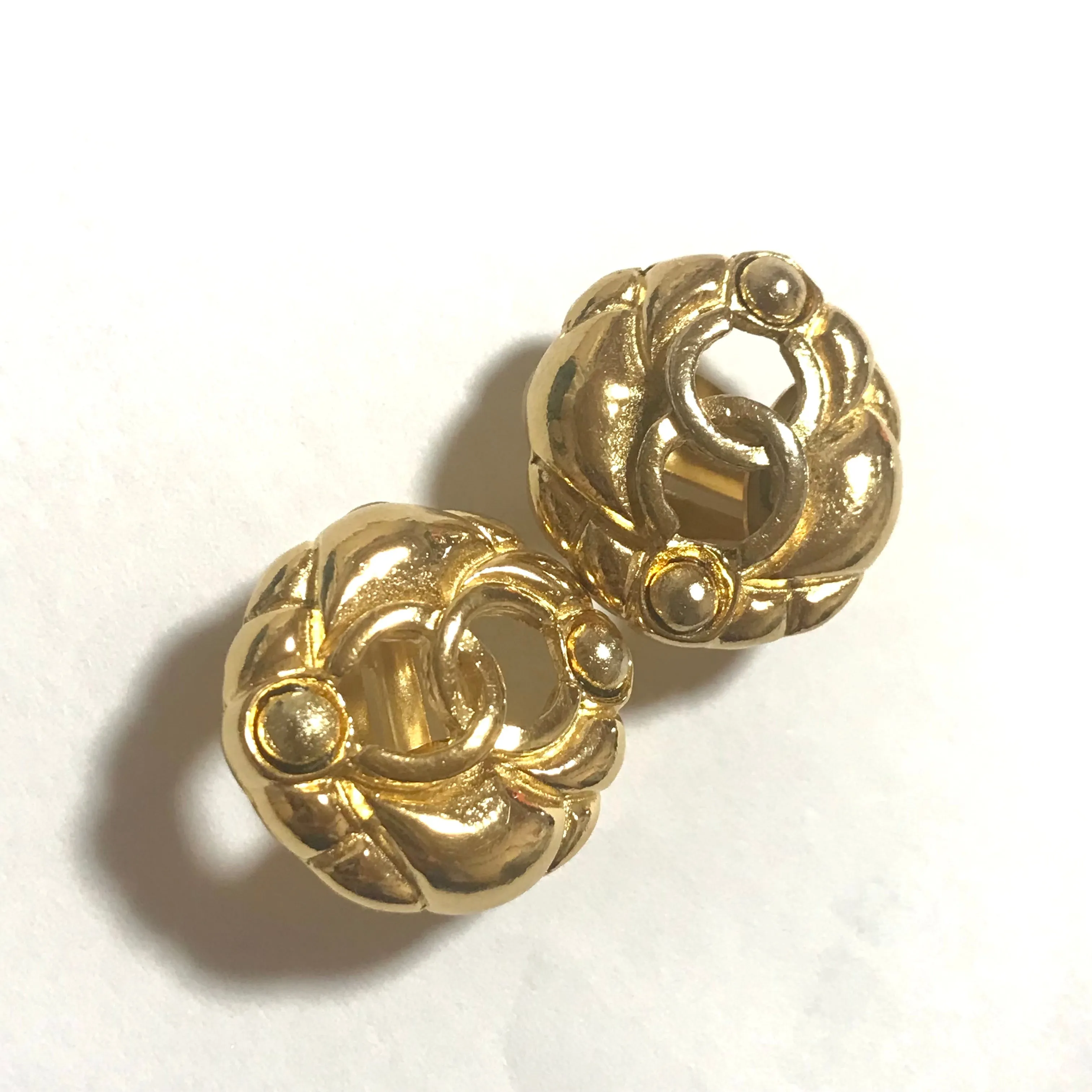 Vintage CHANEL gold tone round earrings with CC mark. Classic vintage Chanel jewelry.