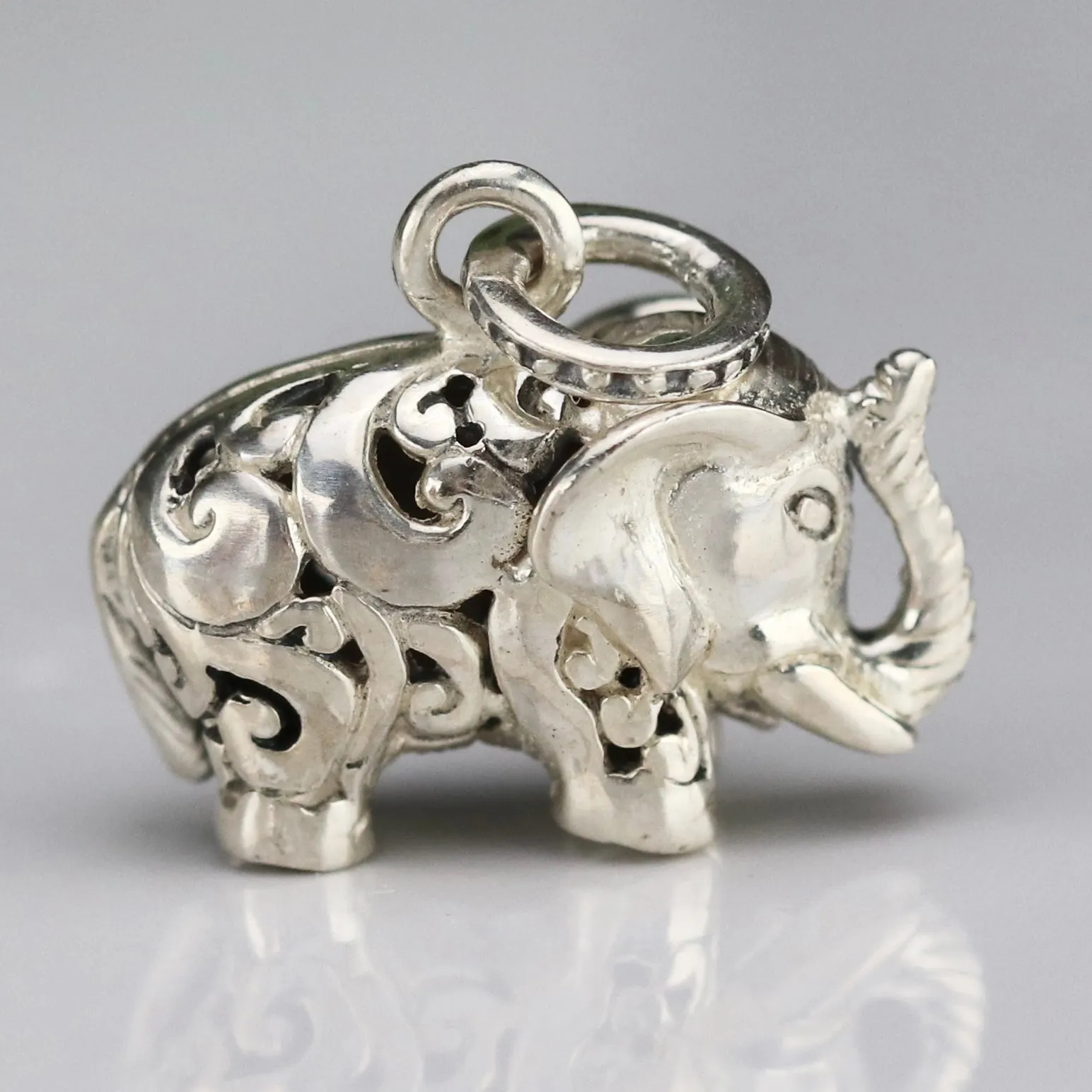 Vintage engraved puffed sterling silver elephant pendant