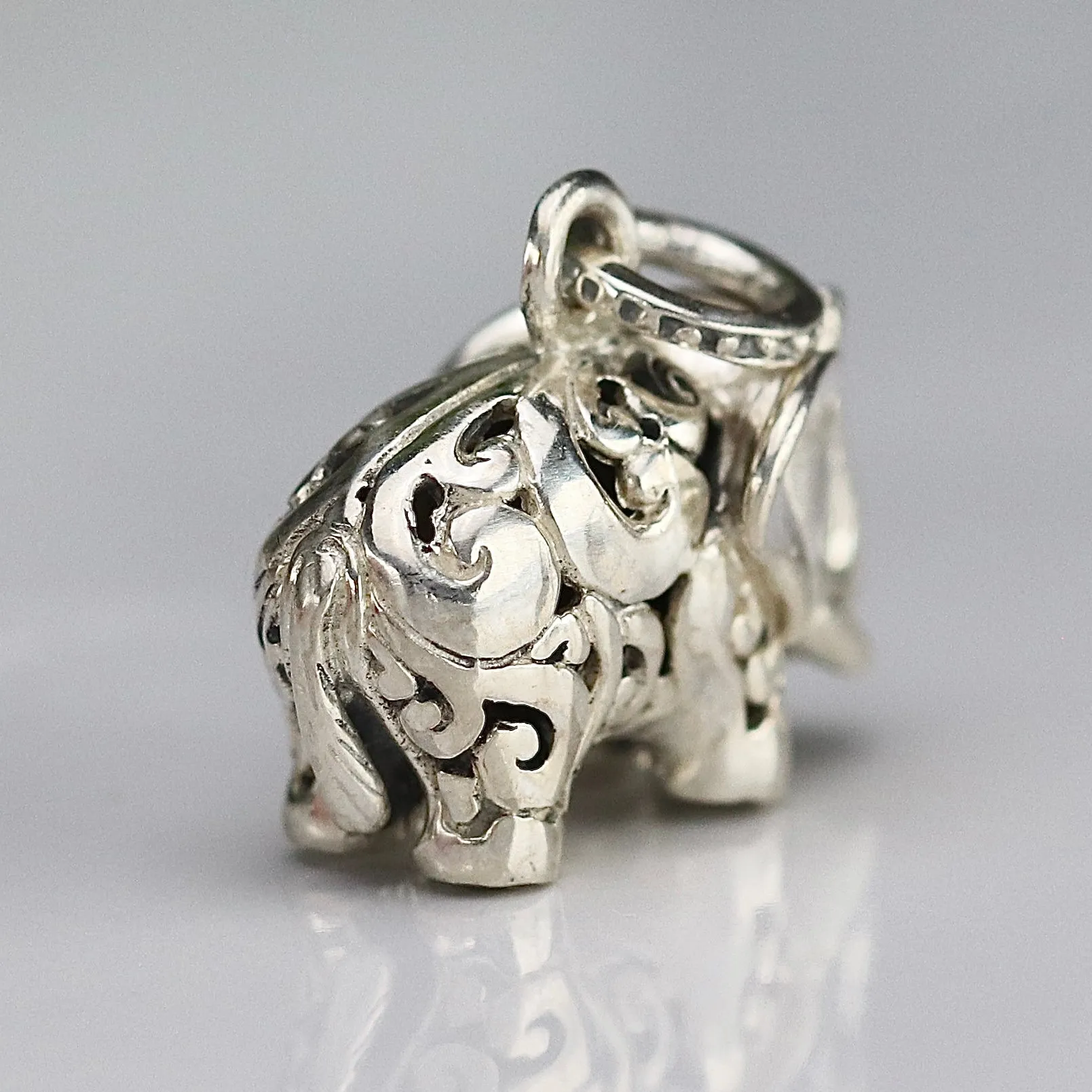 Vintage engraved puffed sterling silver elephant pendant