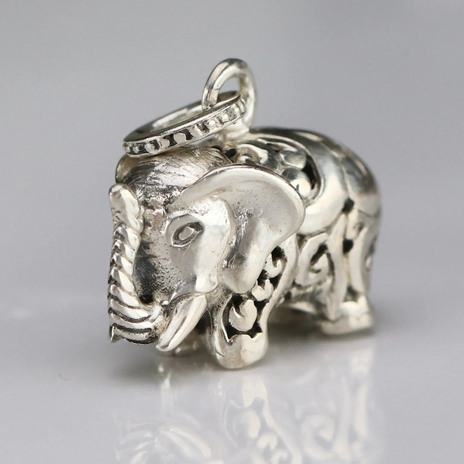 Vintage engraved puffed sterling silver elephant pendant