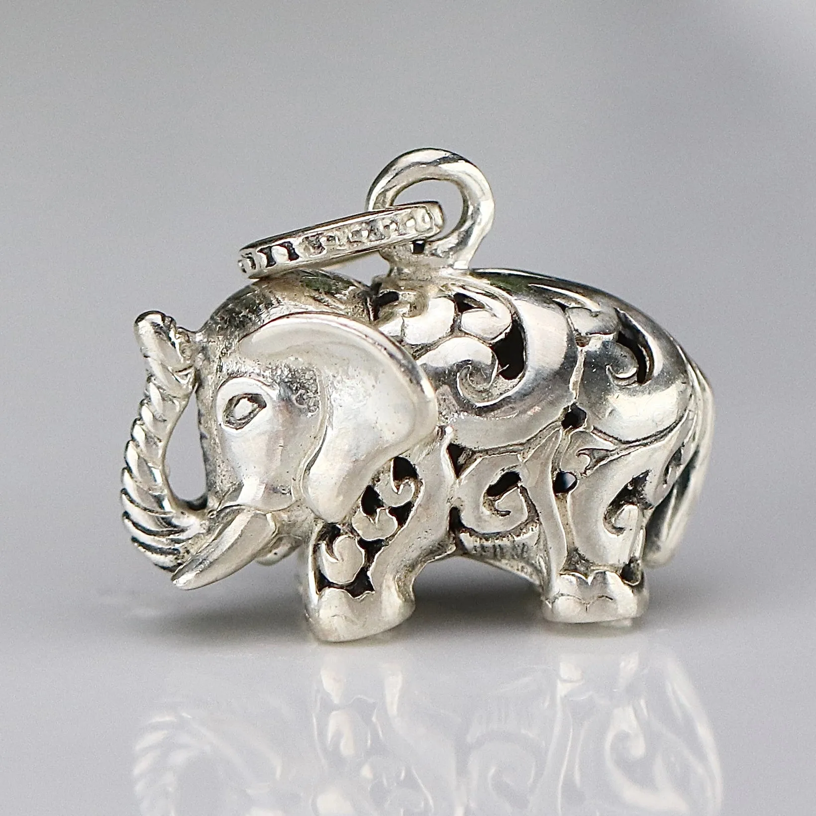 Vintage engraved puffed sterling silver elephant pendant