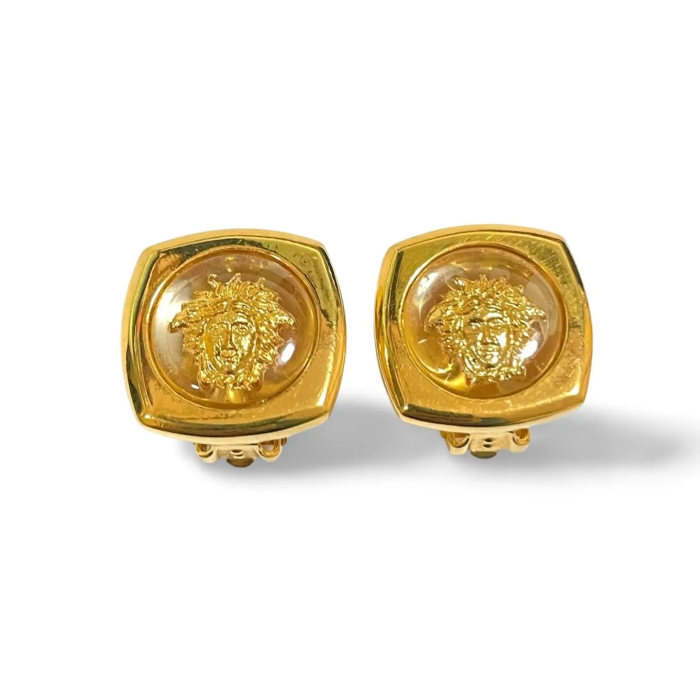 Vintage Gianni Versace clear and gold tone medusa face motif earrings. Classic jewelry. 060305m