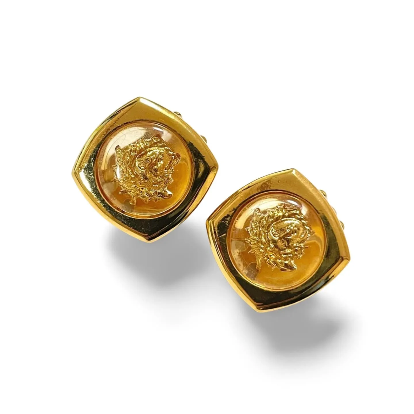 Vintage Gianni Versace clear and gold tone medusa face motif earrings. Classic jewelry. 060305m