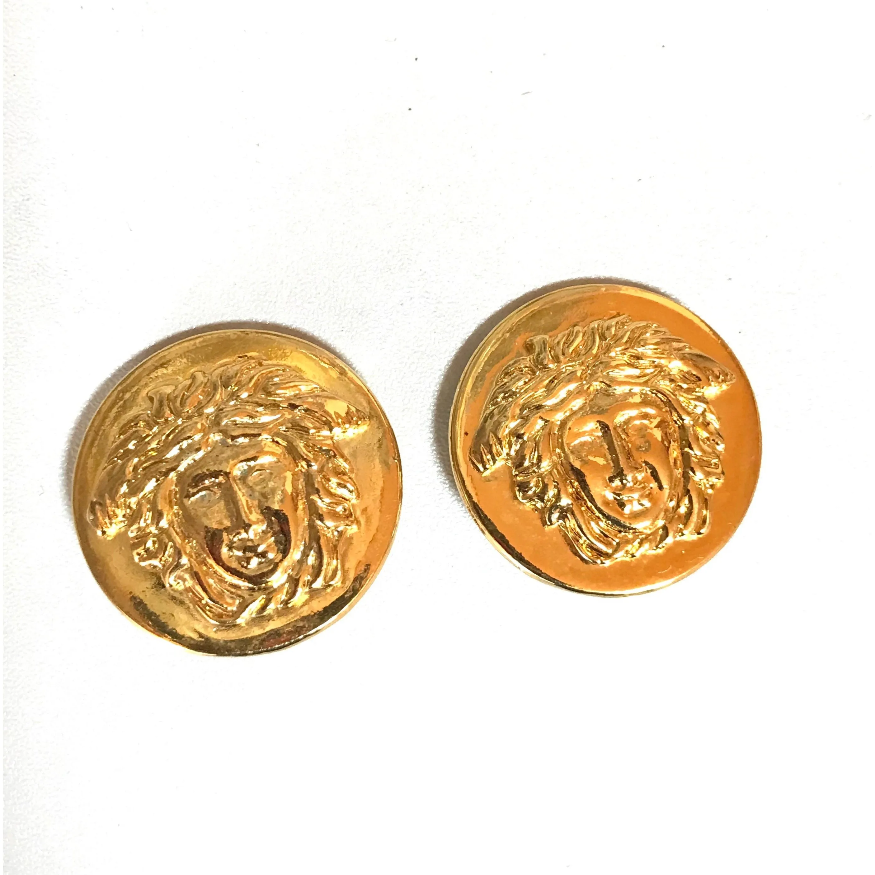 Vintage Gianni Versace round gold tone medusa face motif earrings. Must have Lady Gaga style jewelry piece. Great gift. 060523re4